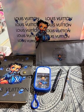 Blue and gray journal with matching bookmark, pen, pouch. Spray bottle.